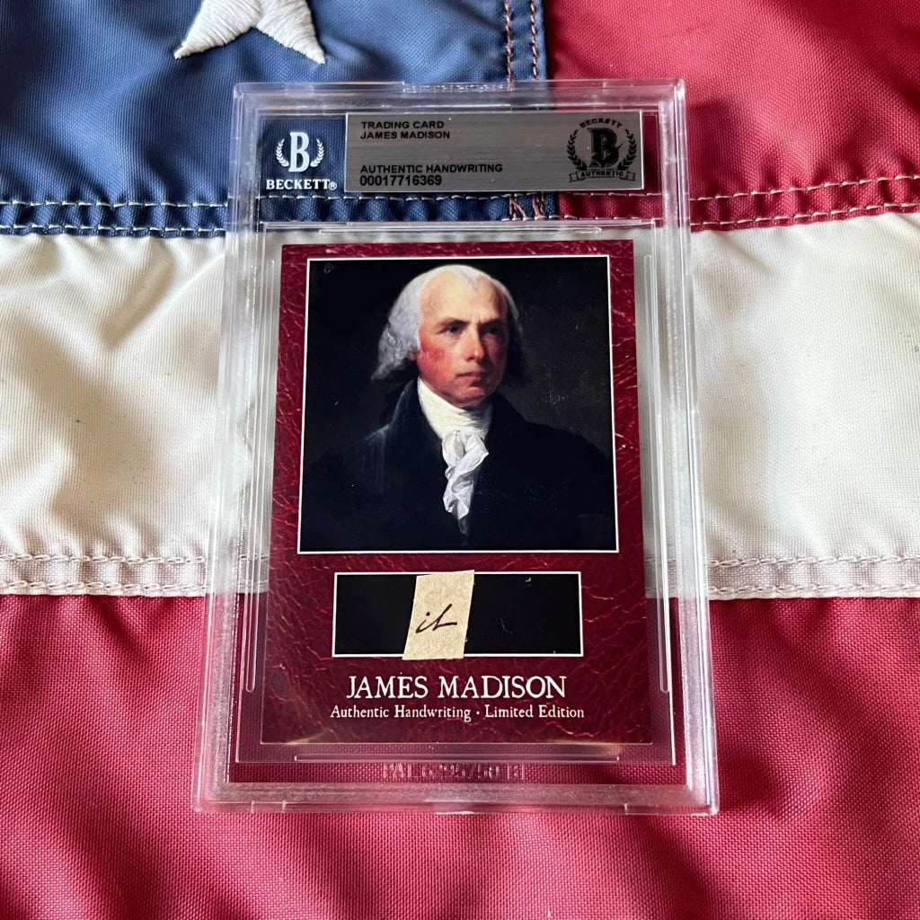 A red textured james madison authentic handwritten autograph trading card encased in a clear beckett protective slab