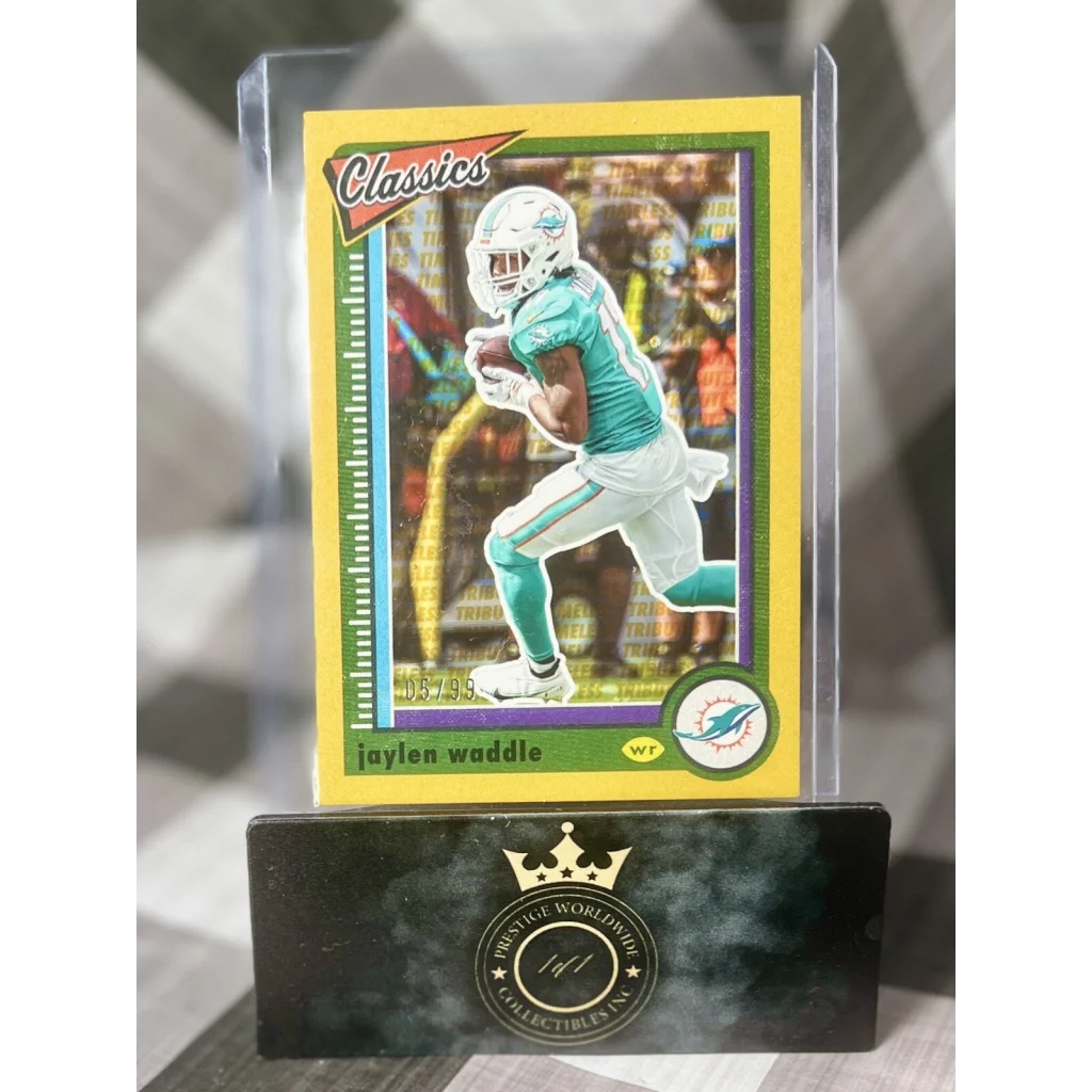 Jaylen Waddle gold Prestige Worldwide collectibles card in teal uniform