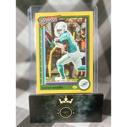 Jaylen Waddle gold Prestige Worldwide collectibles card in teal uniform