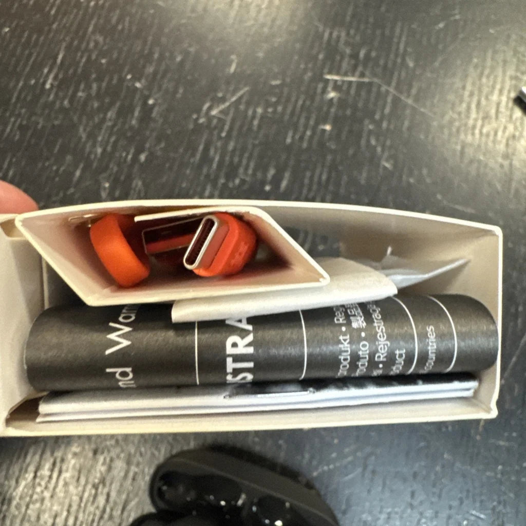 JBL Vibe Beam orange USB-C cable in beige box with accessories