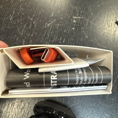 JBL Vibe Beam orange USB-C cable in beige box with accessories