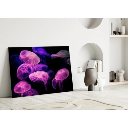 Glowing pink purple jellyfish glass wall art on black background