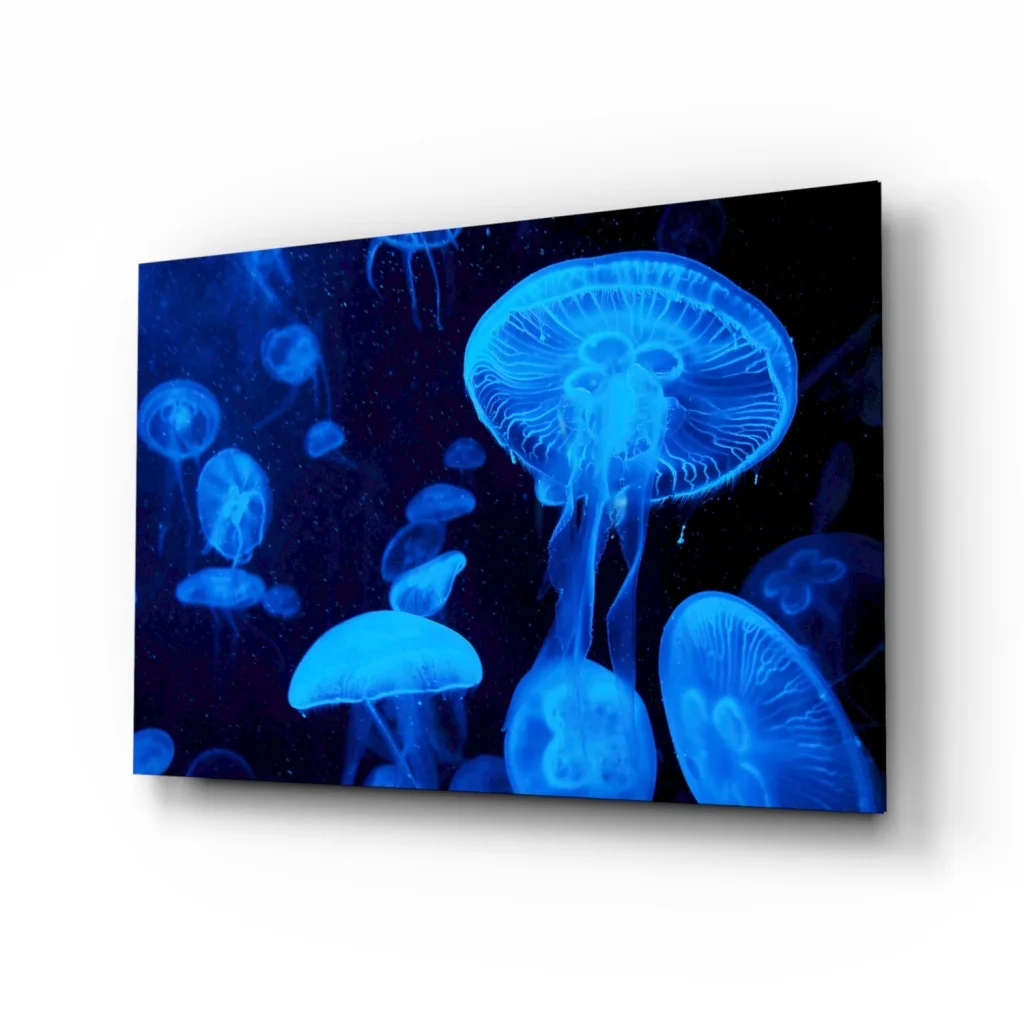 Glowing blue jellyfish canvas wall art print on rectangular canvas