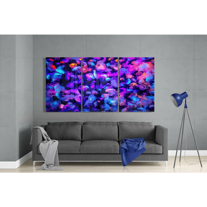 Glowing jellyfish triptych canvas wall art in neon purple blue pink