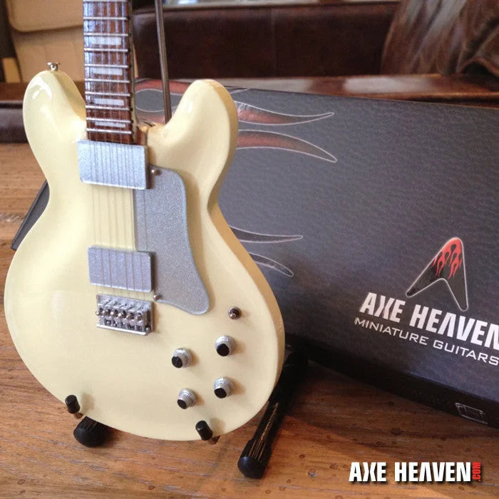 Cream-colored Jerry Garcia Axe Heaven® miniature guitar replica on adjustable A-frame stand