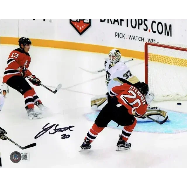 Autographed Hockey Action Photo featuring Jersey Devils Autographed 8x10 shot