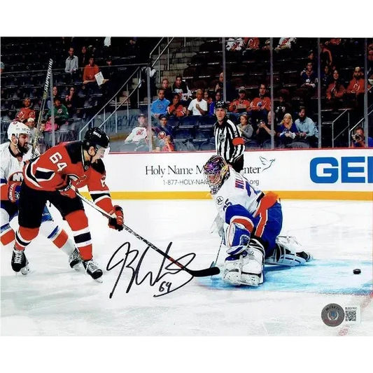 Autographed hockey puck with Devils players on ice, part of Jersey Devils autographed collection