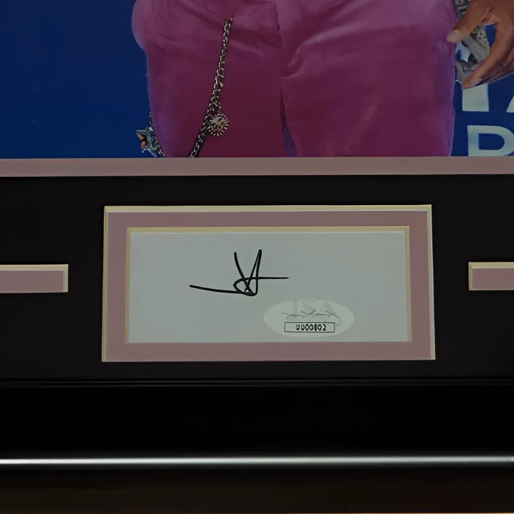 A black-framed jimmie allen autographed cma signature series frame with white signature on cream paper and oval authentication sticker
