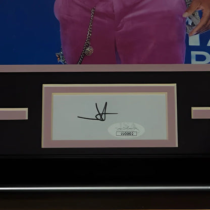 A black-framed jimmie allen autographed cma signature series frame with white signature on cream paper and oval authentication sticker