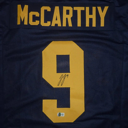 Autographed JJ McCarthy Michigan Wolverines blue jersey number 9