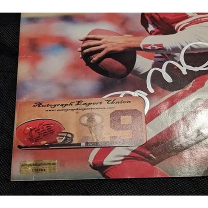 Joe Montana auto signed football helmet with Beckett sticker on football player poster