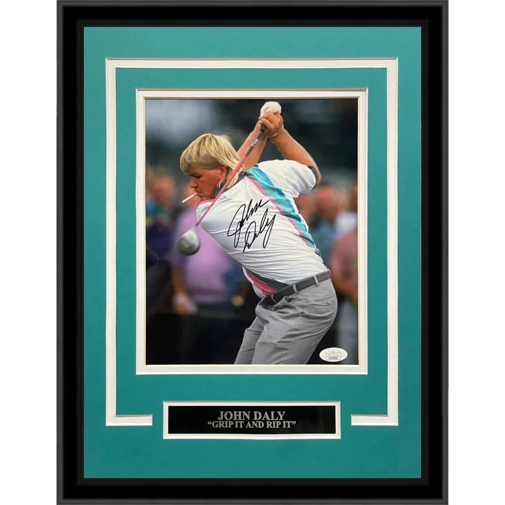 John Daly autographed golf photo in mid-swing, framed with cigarette