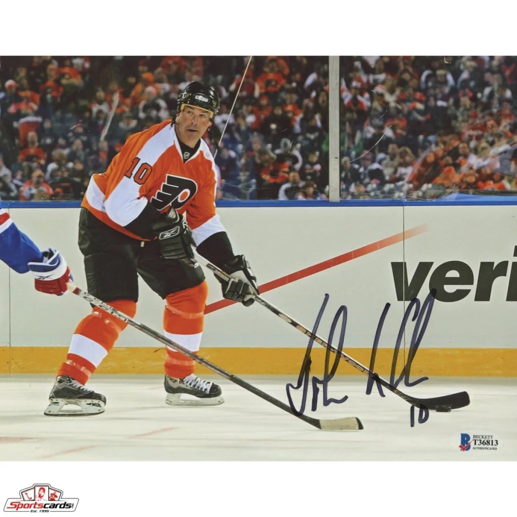 John LeClair signed photo with hockey stick, Flyers jersey, Beckett authentication