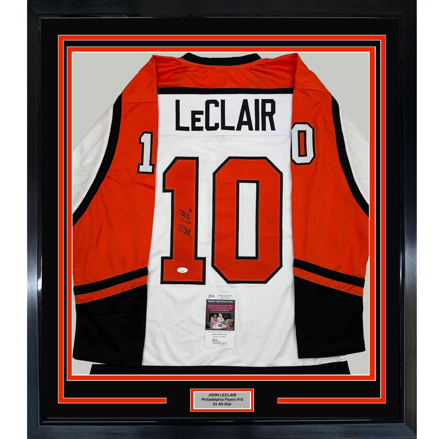 Framed Philadelphia Flyers jersey number 10 with LeClair nameplate, red white and black colors, displaying JSA authentication certificate, front view in black frame.