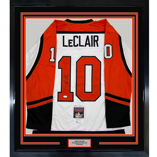 Framed Philadelphia Flyers jersey number 10 with LeClair nameplate, red white and black colors, displaying JSA authentication certificate, front view in black frame.