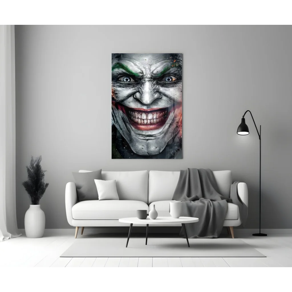 Striking Joker face glass wall art with green red details on gray wall