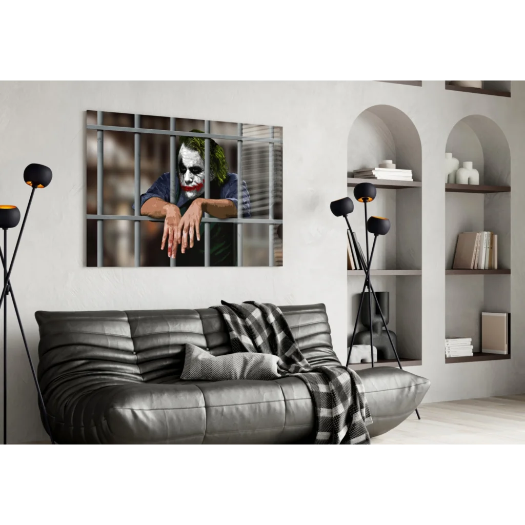 Black leather sofa with plaid throw and Joker behind bars wall art