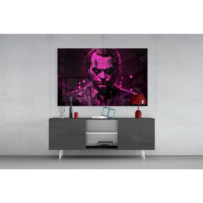 Vibrant Joker glass wall art with magenta black portrait on purple splatter canvas