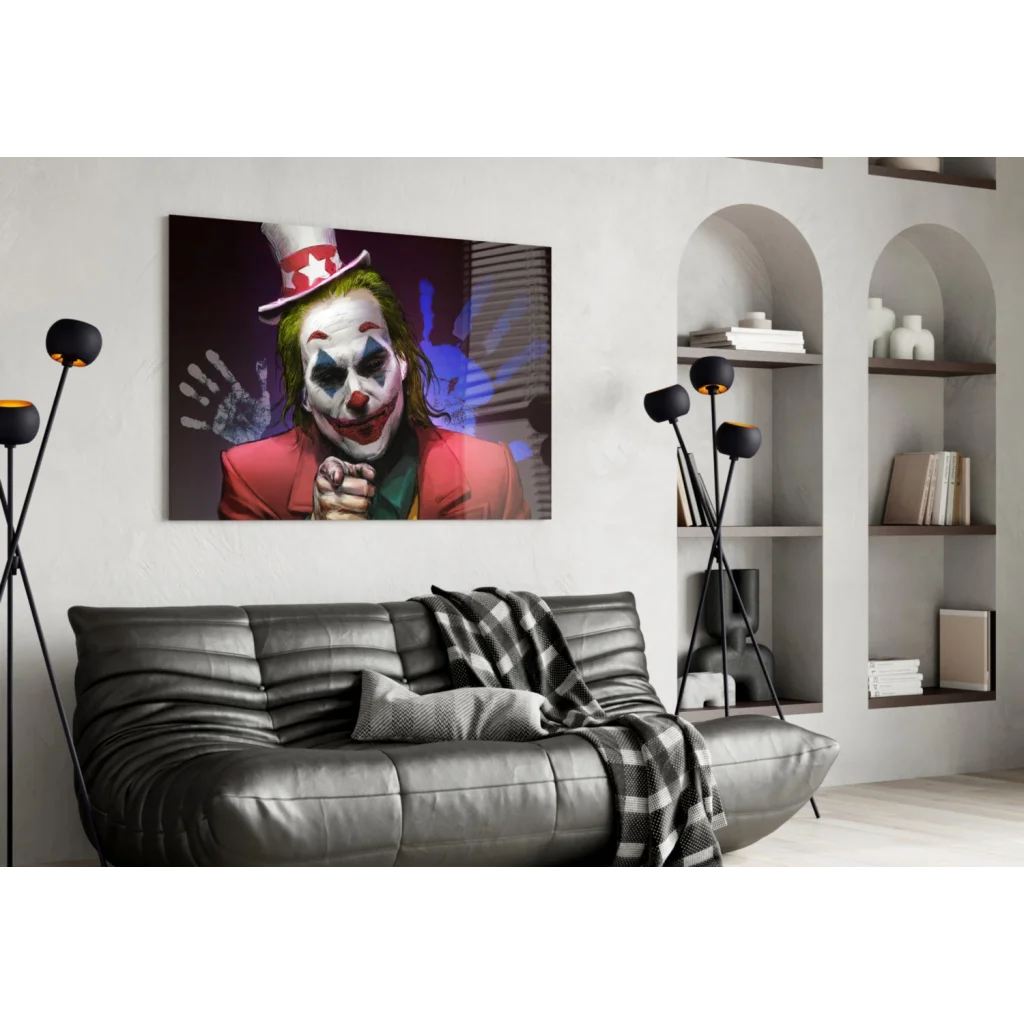 Joker glass wall art with black leather couch and striped throw
