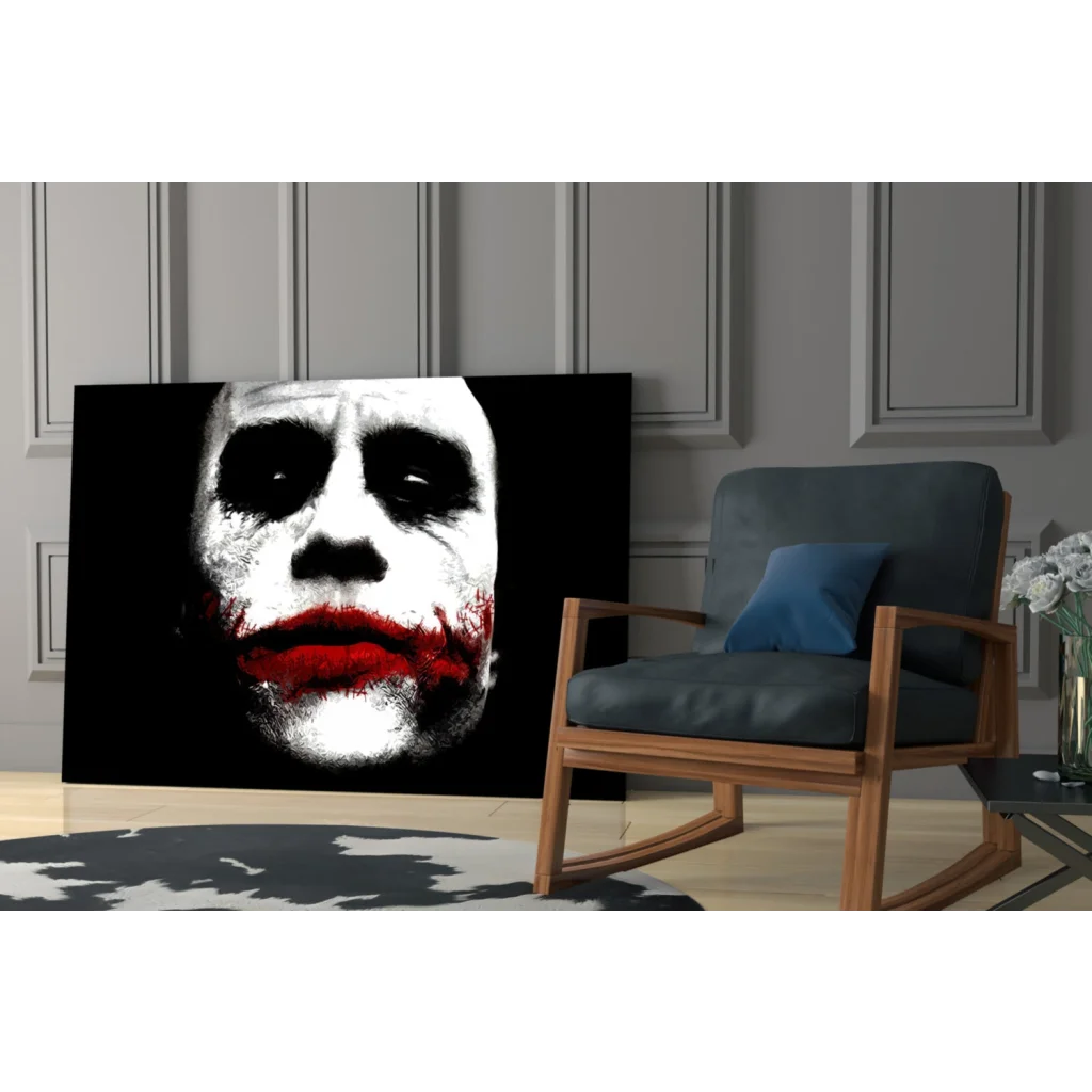 Black-and-white Joker canvas wall art with bold red lips on wall