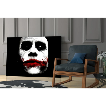 Black-and-white Joker canvas wall art with bold red lips on wall