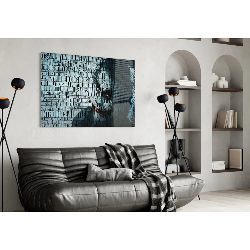 Black leather sofa with plaid blanket and Joker quote wall art