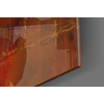 Joker canvas glass wall art with swirling amber gold hues