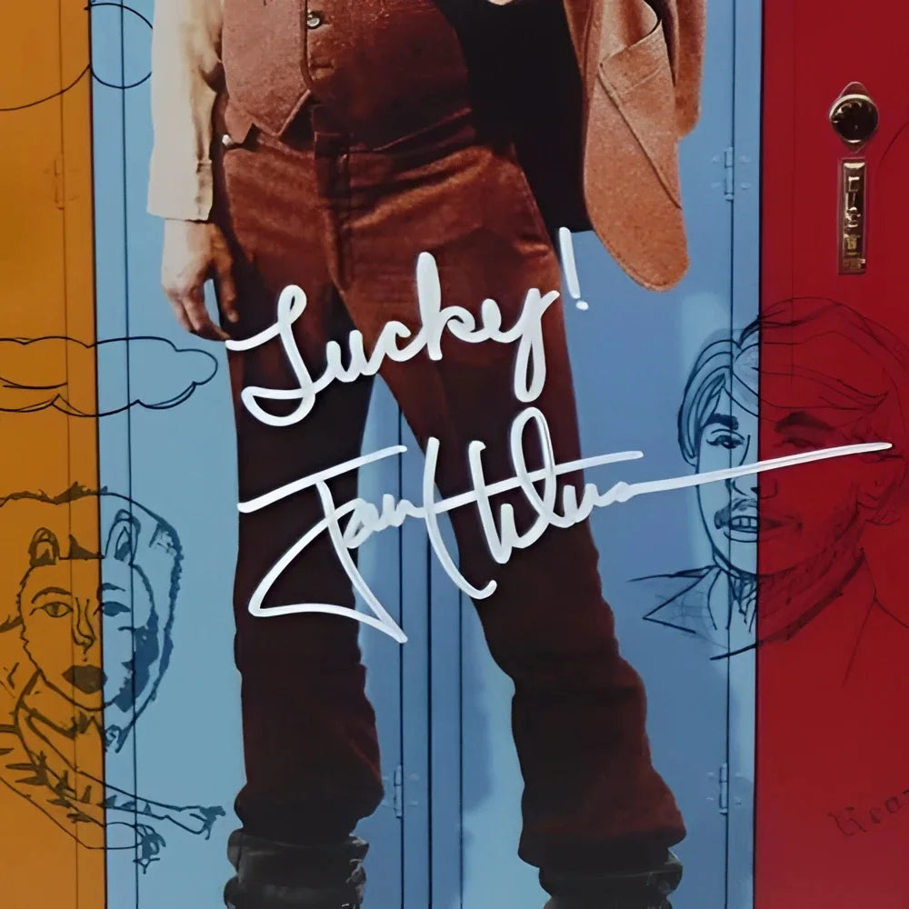 Jon Heder autographed Napoleon Dynamite poster with brown leather jacket and red pants on blue background