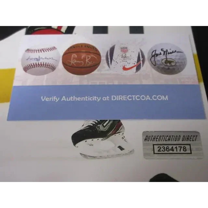 White sheet with autographed sports memorabilia images and authenticity sticker for Jonathan Toews signed 8x10 photo