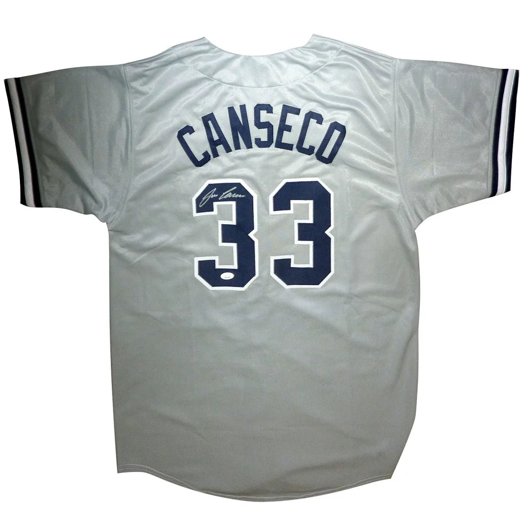 Jose Canseco autographed silver baseball jersey with navy Canseco 33 back