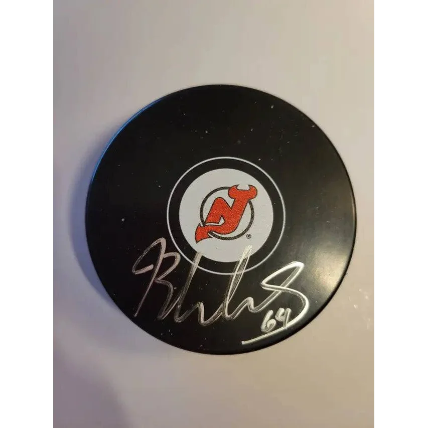 Autographed hockey puck with New Jersey Devils logo and silver autograph for collectors