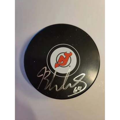 Autographed hockey puck with New Jersey Devils logo and silver autograph for collectors