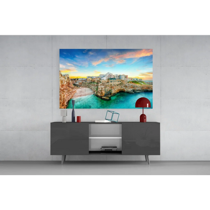 Coastal town glass wall art with turquoise waters and cliffs