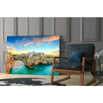 Vibrant coastal town glass wall art with turquoise waters and golden cliffs