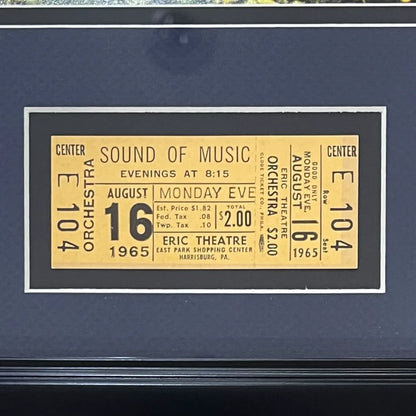 Yellow vintage ticket for the 1965 musical sound of music displayed with julie andrews autographed 11x14 photo deluxe frame