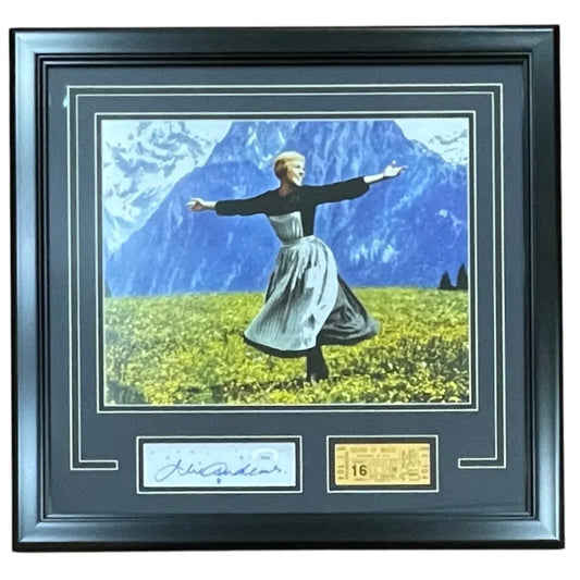 Black framed 11x14 photo of julie andrews signed print showing woman dancing in traditional dress with mountains behind