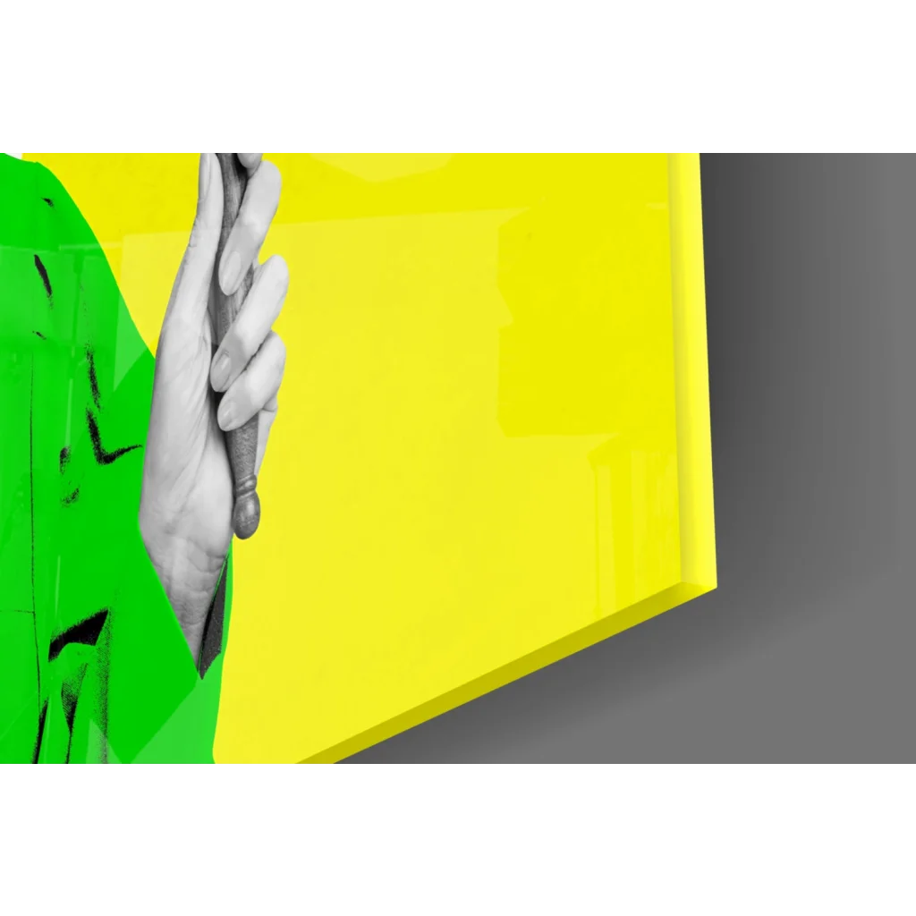 Vibrant yellow neon justice glass wall art held by green hand