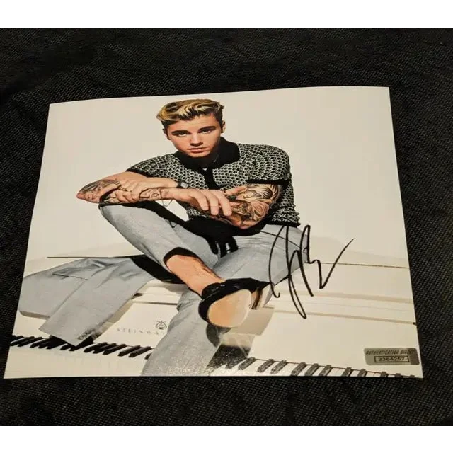 Justin Bieber autographed 8x10 photo sitting on a white piano, certified authentic