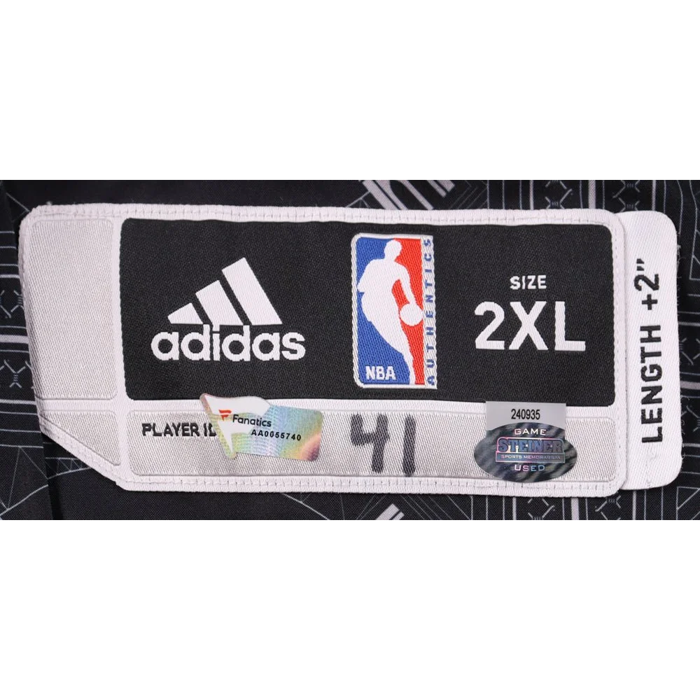 Black and white Adidas NBA jersey tag on Justin Hamilton Brooklyn Nets jacket for authenticity