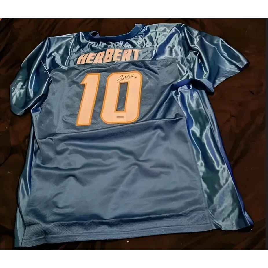 Light blue Justin Herbert autographed jersey with number 10 and signature for fans