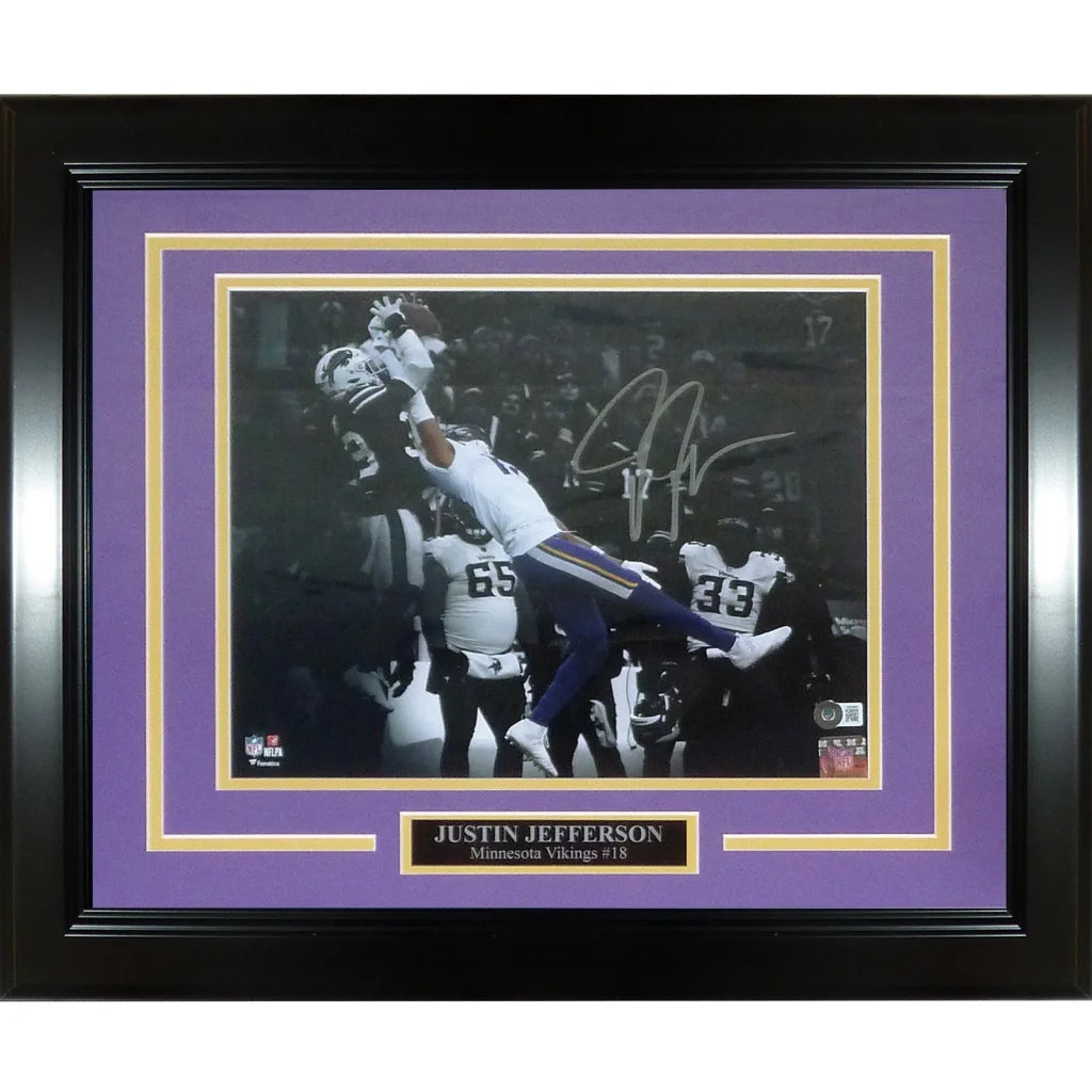 Deluxe framed Justin Jefferson spotlight catch photo with black frame, purple mat, gold accents, and autograph