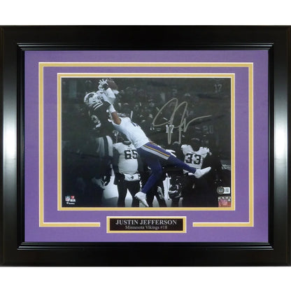Deluxe framed Justin Jefferson spotlight catch photo with black frame, purple mat, gold accents, and autograph