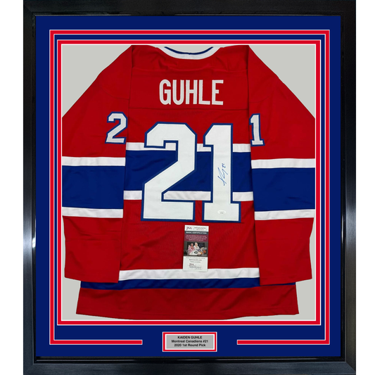 Framed Montreal Canadiens red, white, and blue hockey jersey number 21 signed by Kaiden Guhle with JSA authentication certificate visible.