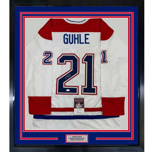 Framed Montreal Canadiens white hockey jersey #21 signed by Kaiden Guhle, displayed front-facing with red and blue matting and JSA authentication certificate visible.