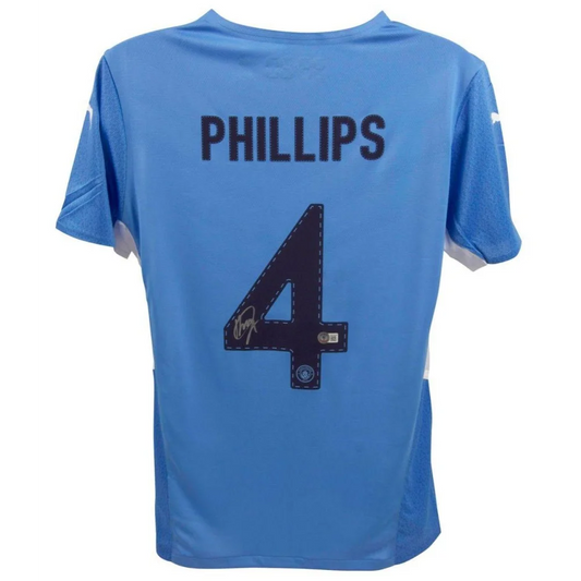 Light blue Manchester City jersey signed by Kalvin Phillips with autograph visible