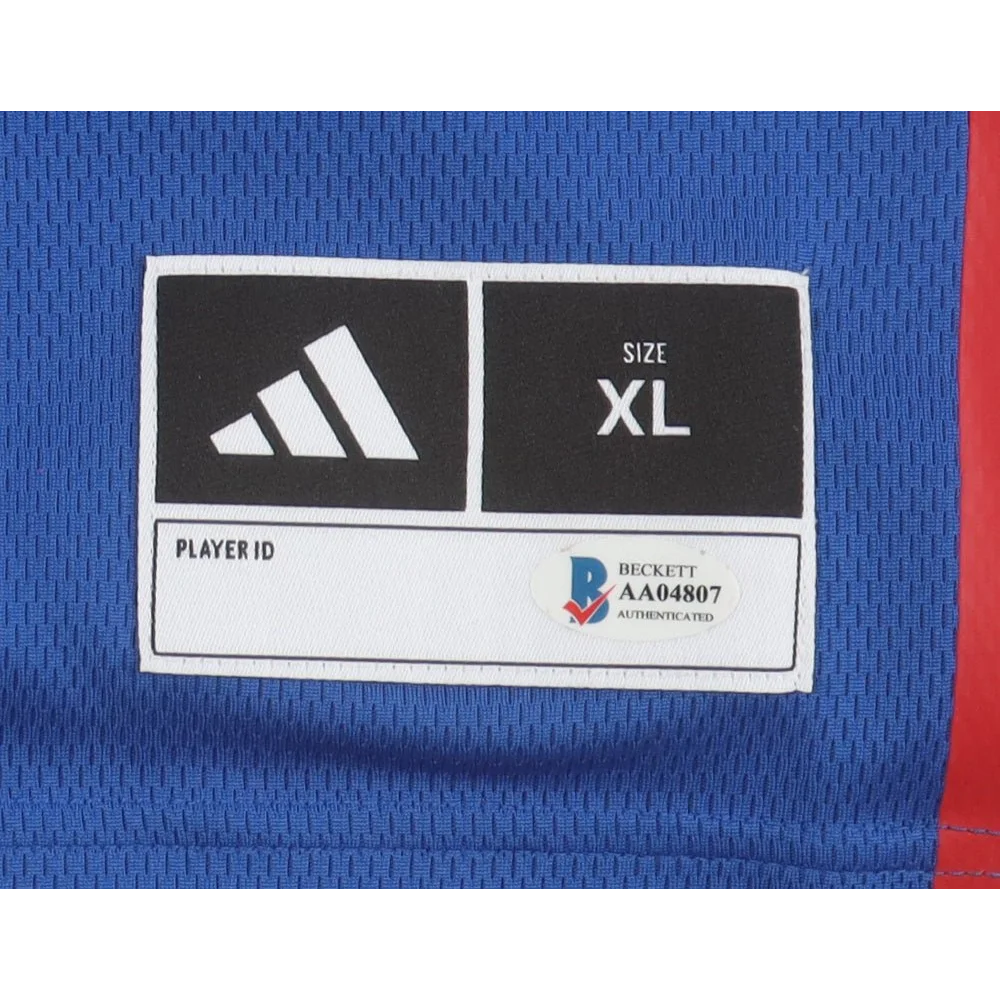 Adidas apparel label with Beckett authentication on Kansas Jayhawks team-signed jersey