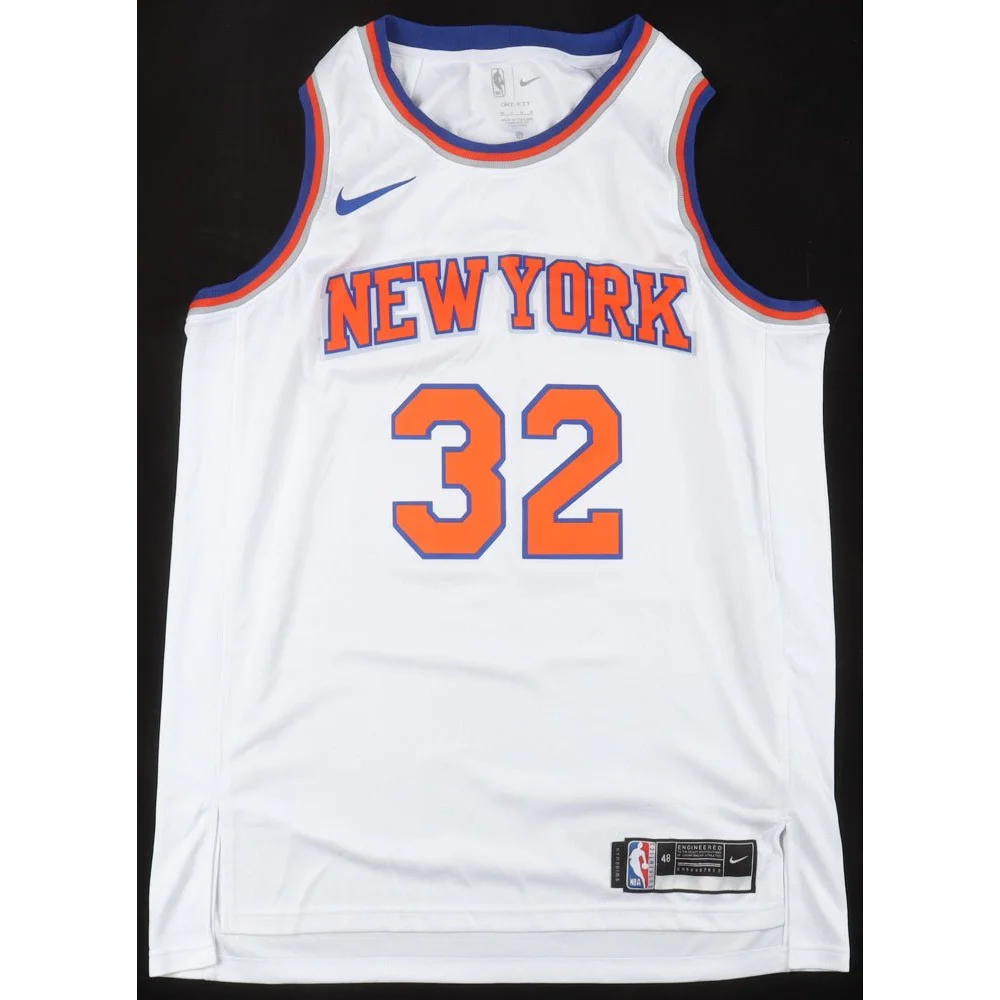 White New York Knicks jersey with 32 in orange and blue, signed by Karl Anthony Towns