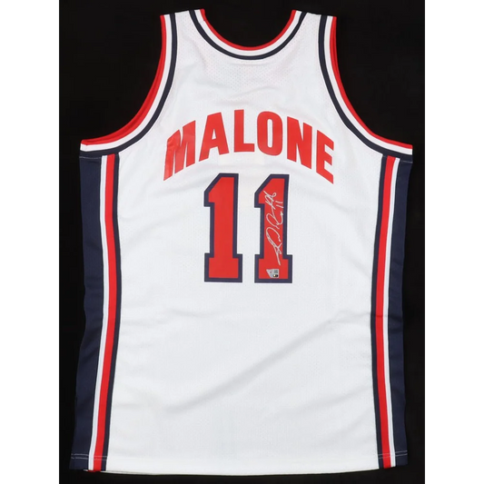 Autographed Karl Malone Jazz jersey with Fanatics Hologram authentication and red navy trim