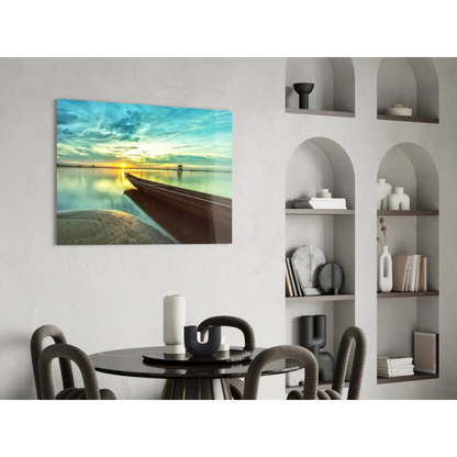 Vibrant sunset glass wall art with boat on calm water above dining table