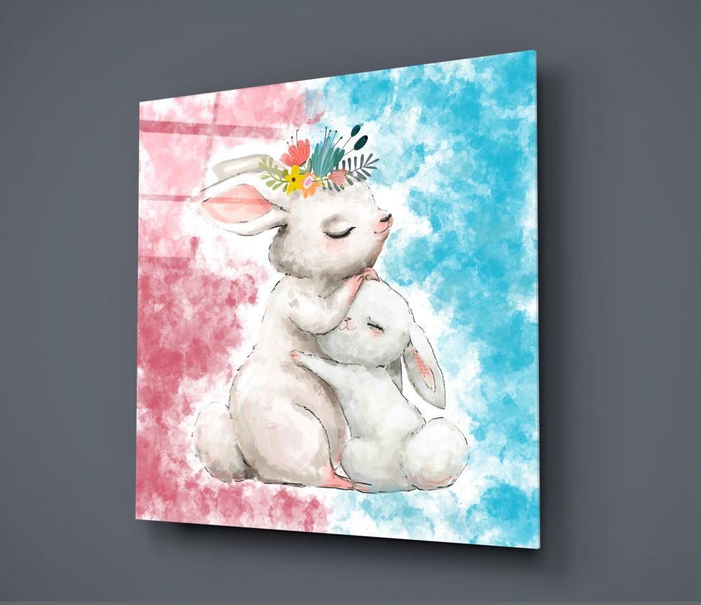 Angled perspective of glass wall art featuring a white rabbit wearing a colorful flower crown against pink and blue watercolor backgrounds.